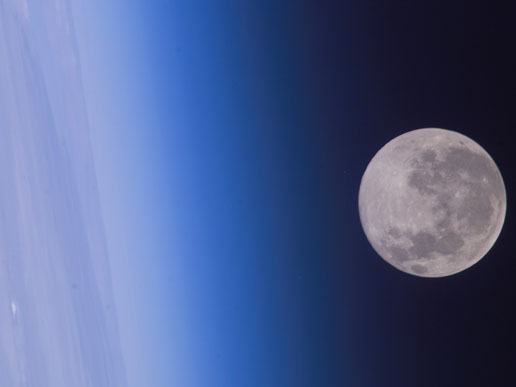 Full moon floats in space