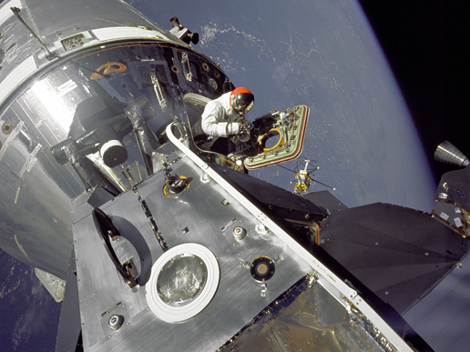 Astronaut Dave Scott stands in the hatch of the module