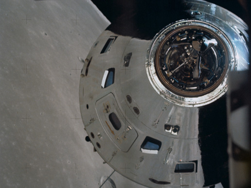 Surface of the moon reflected in Apollo 17's command and service module.