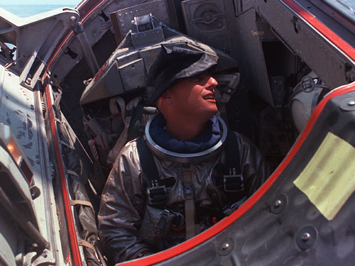 Charles Conrad Jr., Gemini 5 pilot, sits in the Gemini Static Article 5 spacecraft.