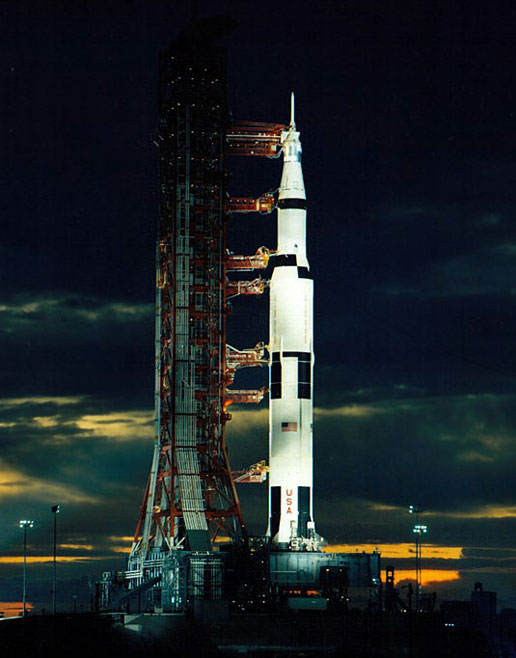 As spotlights play on the rocket and launch pad at dusk, the last moon shot, Apollo 17, is pictured here awaiting its December 1972 night launch.