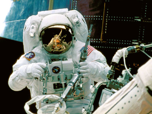 Astronaut Steve Smith works on Hubble during the second servicing mission in 1997.