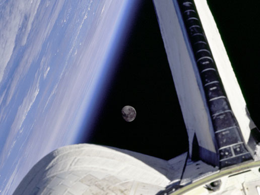 The Earth and its moon as seen from Space Shuttle Discovery