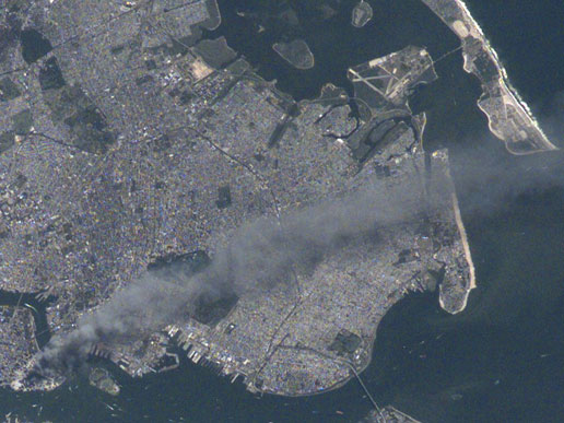 This image of metropolitan New York City taken by the International Space Station's Expedition 3 crew shows the smoke plume rising from the Manhattan on Sept. 11, 2001.
