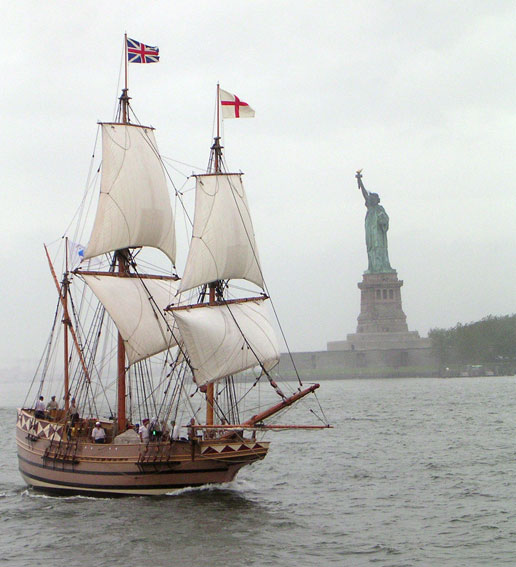 A replica of the 17th century ship Godspeed sails past the Statue of Liberty in New York harbor.